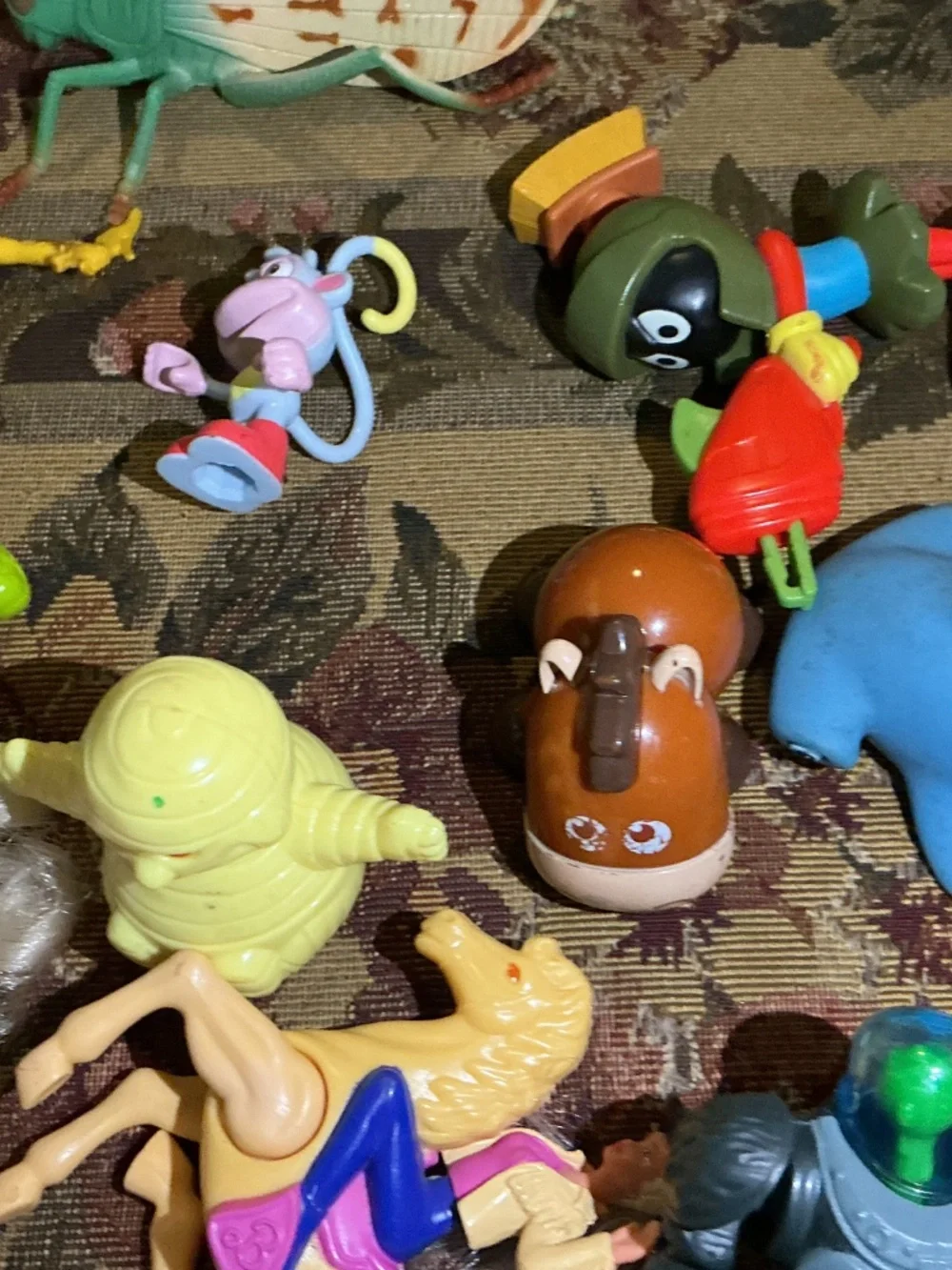32 Miscellaneous small Toy lot with NBA Bionicle looney tune barbie and more